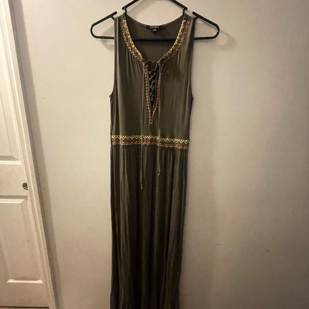 Long dark green dress with pink and yellow outline.